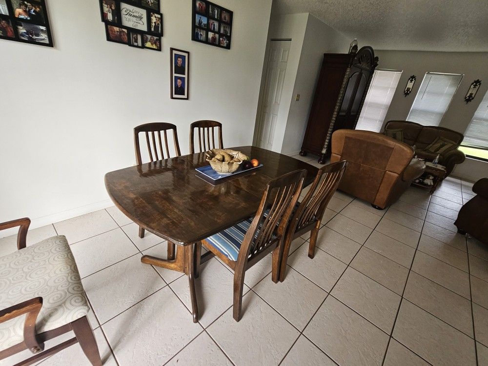 Wooden Table With 4 Chairs. 5th Chair Availble. Photographed.