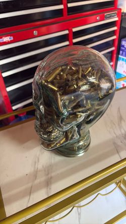 Glass skull with brass casings