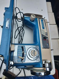 AI Overview    +2                    This is a vintage Morse Model 4300 sewing machine, recognized by its distinctive blue color and metal model plate