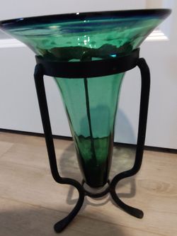 Beautiful small green vase with blue rim and metal stand