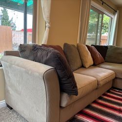 Tan 3 piece sectional L shape with large circle spinning seat