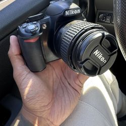 Nikon D3100 with 18-55mm lens or 35mm lens