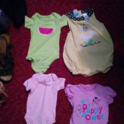 FOUR BABY GIRL'S ONESIES.