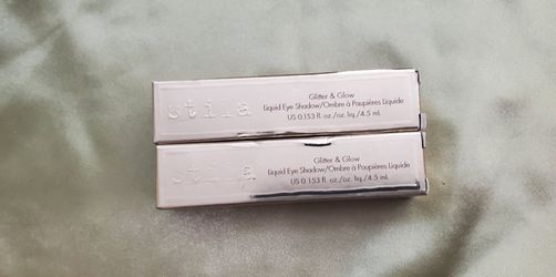 Two New Stila Glitter & Glow Liquid Eye Shadow tubes in Shades Molten Midnight & Smoldering Satin