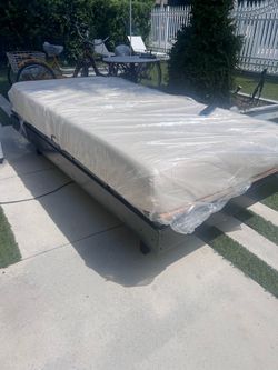 Electric adjustable bed with a gel mattress.$250 E/C or 2 for $450