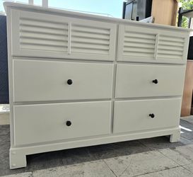 Cute real wood dresser.