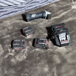 Three BOSCH batteries and a charger