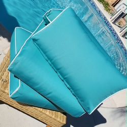 A pair of sit and back cushions 27"L, 24"W and 6" tall like new/outdoor or indoor cushions.