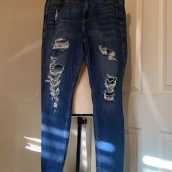 Hollister distressed skinny jeans in a dark wash.