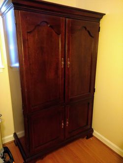 Armoire made of solid wood. Very nice piece of furniture. Paid $1,200 years ago. Almost giving it away at $100 obo.