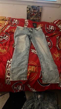 Light blue or gray acid-wash relaxed straight-leg denim jeans