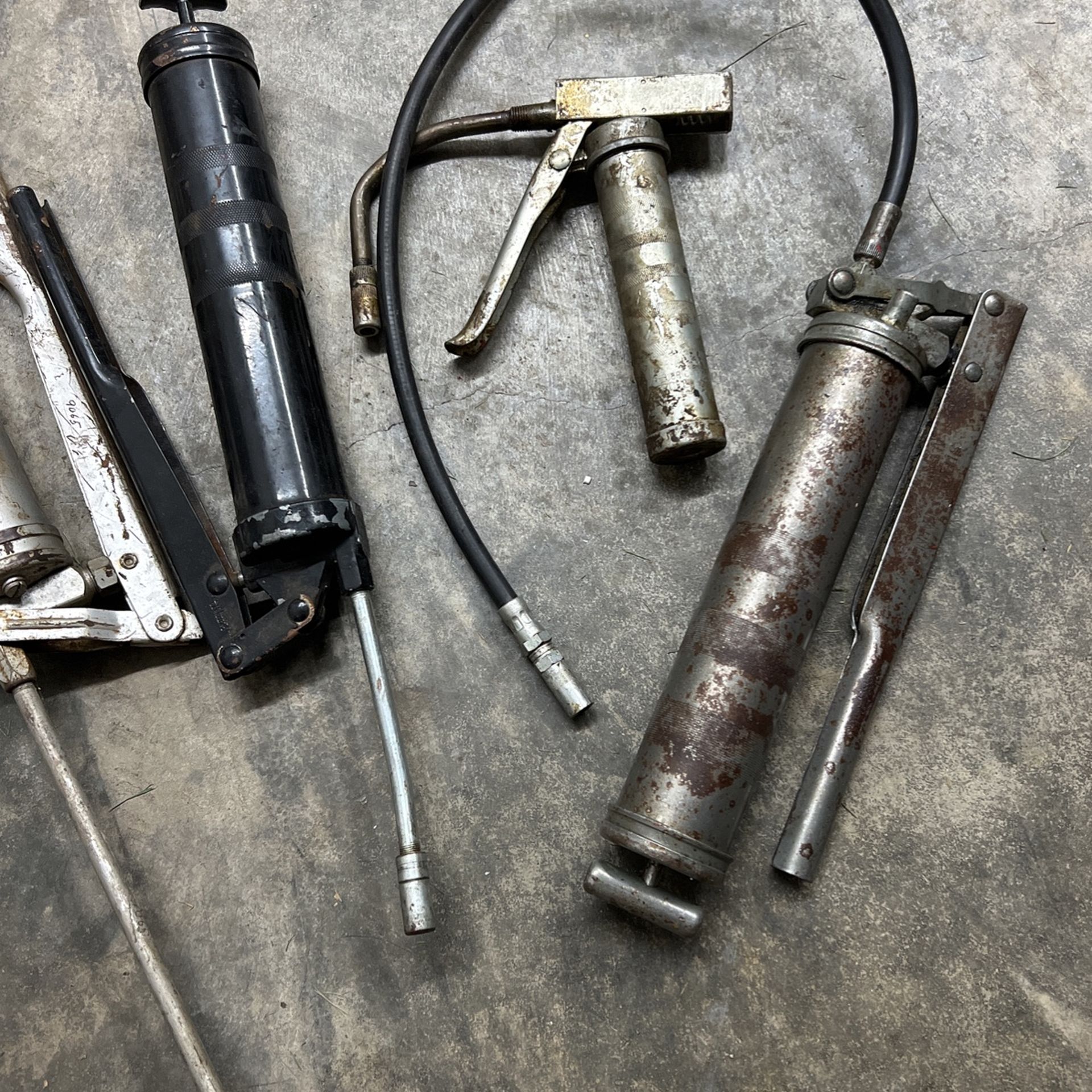 Four Grease Guns Business equipment