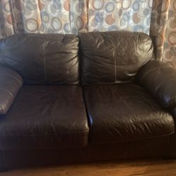 Brown leather Ashley loveseat