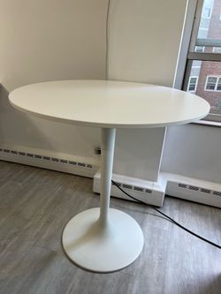 Bar-height white round table 42" tall 40" wide