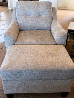 Almost new, very comfortable gray chair with ottoman