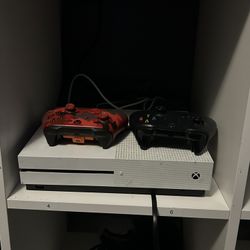 I'm selling an Xbox One in good condition with two controllers.