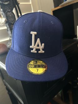 New Era 59FIFTY Los Angeles Dodgers baseball cap featuring an embroidered white "LA" logo on a blue structured crown