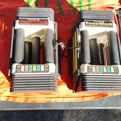 PAIR  OF  POWERBLOCK ADJUSTABLE DUMBBELLS : GOES UP TO 45 LB. ON EACH DUMBBELL 