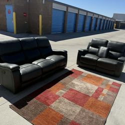 Dark gray reclining sofa & loveseat set