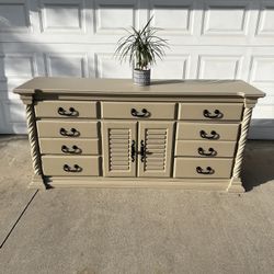 Tan Dresser With Black Hardware