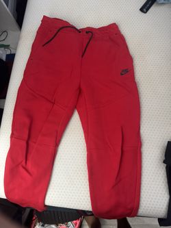Red nike tech pants