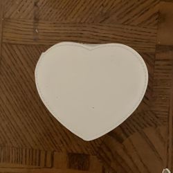 white heart-shaped bag 