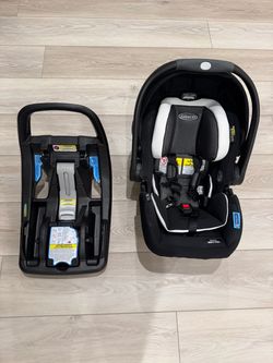 Graco SnugRide 35 DLX infant car seat with its click-in vehicle base on the left.