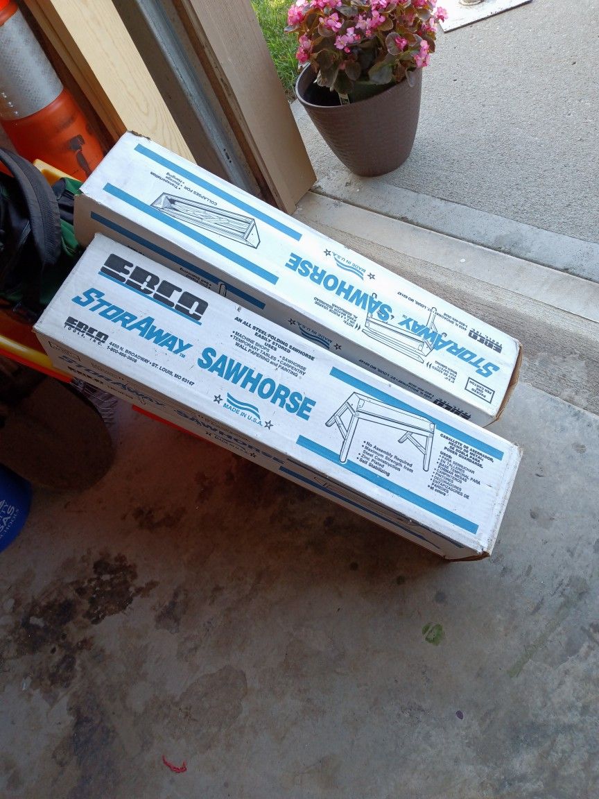 TWO FOLDING METAL SAWHORSES