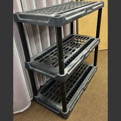 Black plastic 3 tier storage shelving unit. Garage basement shelves 3 shelf storage 