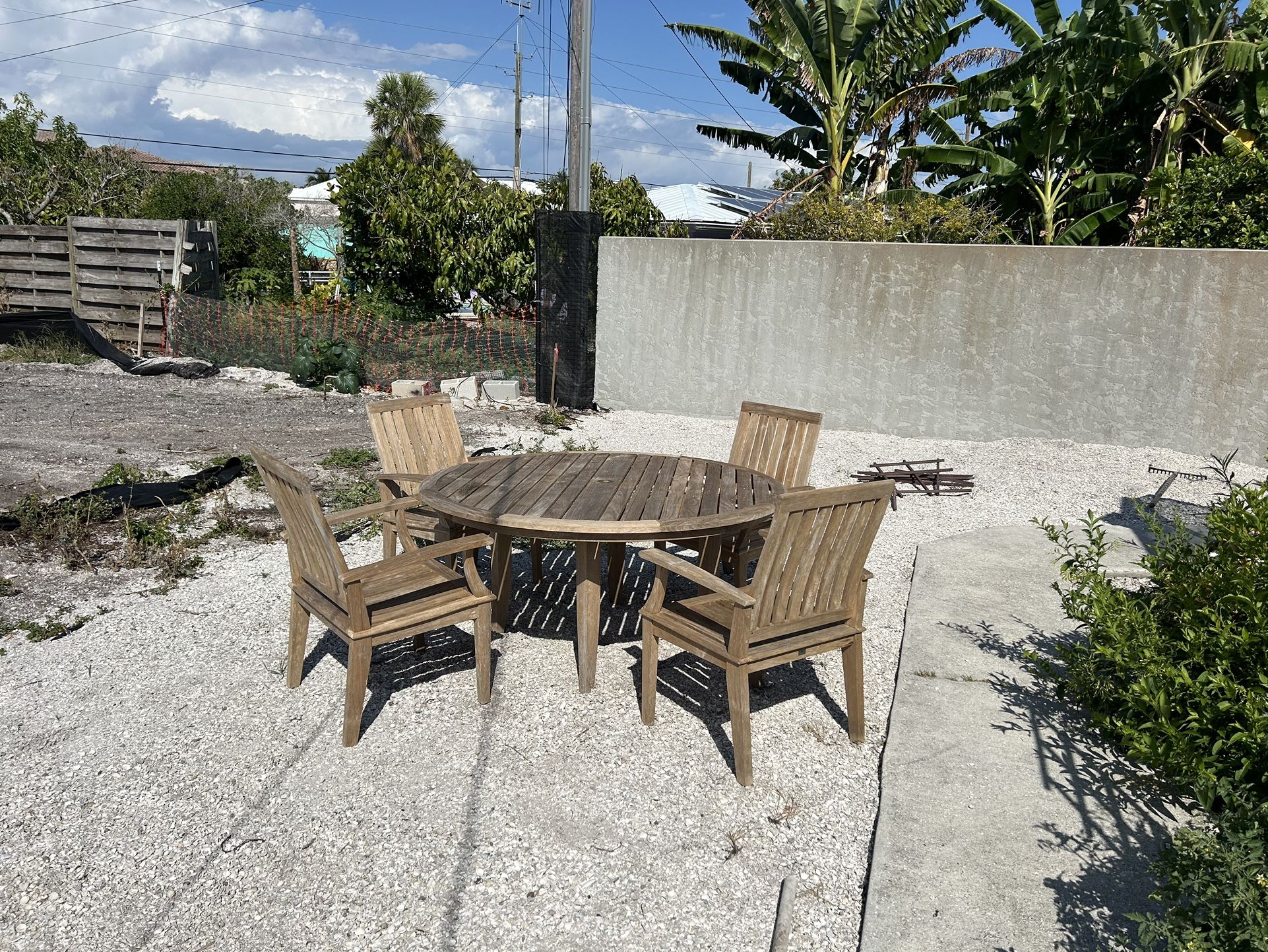 Gloster 48” Round Teak Table With Four Chairs