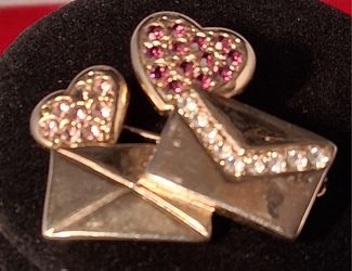 Diamond encrusted rose gold envelope pendant