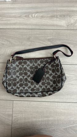 small Coach Signature Canvas shoulder bag with the hangtag still attached and in very good condition.