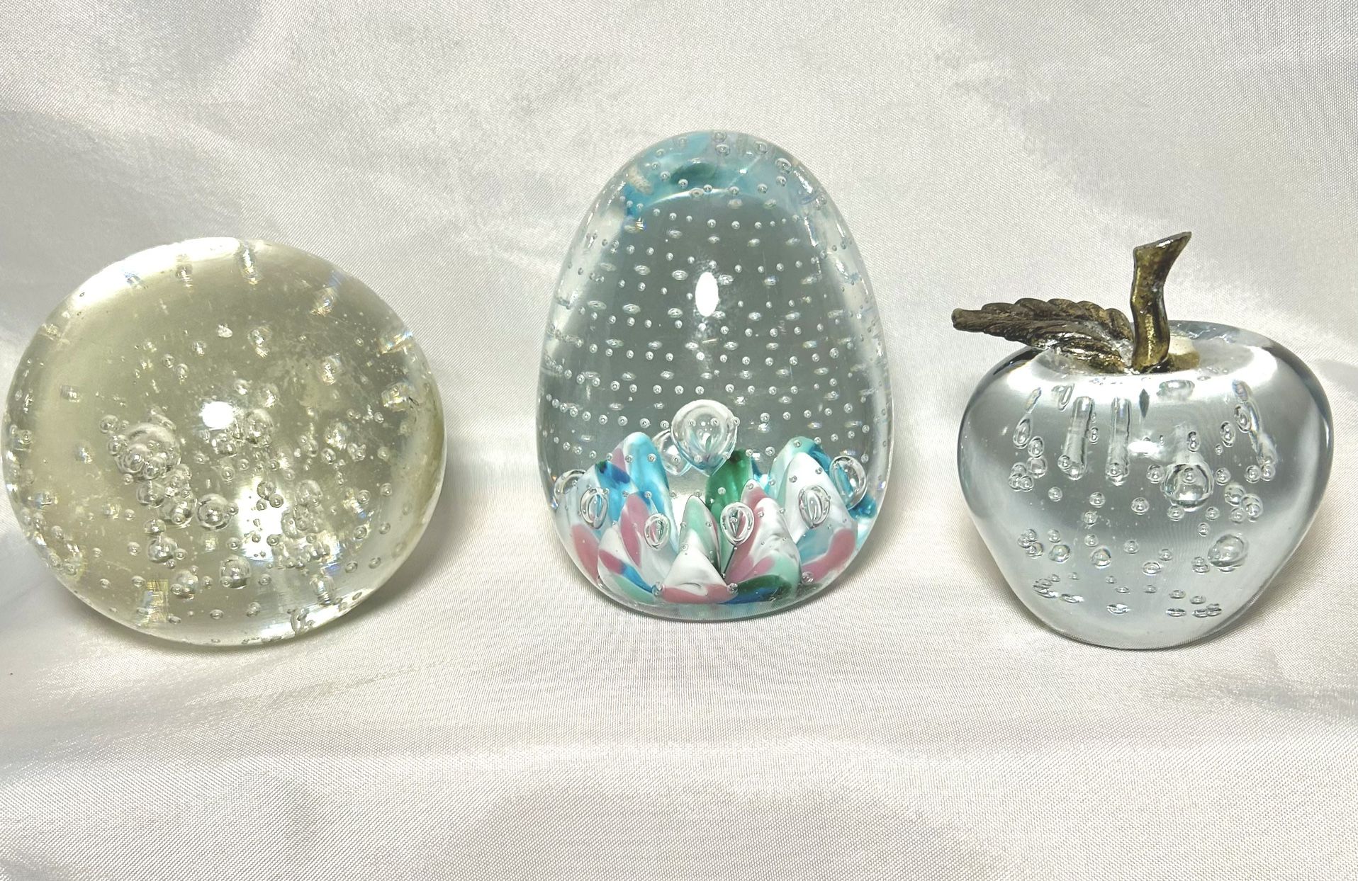 3 glass paperweights controlled bubbles. apple 3”tall. Egg shaped 4”tall Round heavy glass 3”