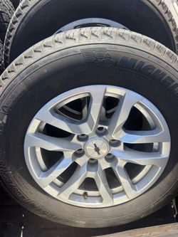 Four 265x65Rx18 and Chevy rims