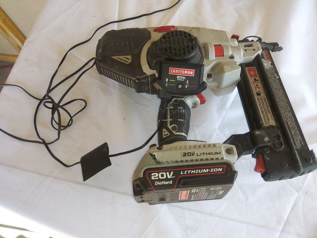 Cordless nail gun with charger and one battery