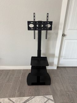 Universal Floor TV Stand + 2 Shelves – Up to 65” – $30