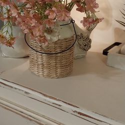 Silk Blossoms In Wicker Glass Vase
