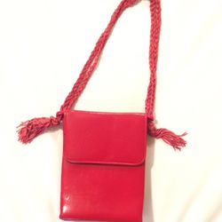 Vintage red Ande purse. Measures 6 x 5 x 2 when closed. Doubled Braided Straps hang 8” and are 19 inches end to end with two little tassels. Black ins