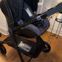 evenflo pivot travel system