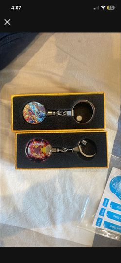 Pokemon Keychains Featuring Charizard And Pulaski