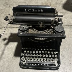 Antique 1930’s LC Smith 8 11  typewriter has 5 rows on the keyboard.  The standard key QWERTY Keyboard plus the additional top row for accounting