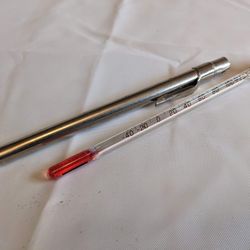 Vintage glass thermometer with metal case
