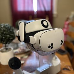 Meta Quest 3s With A Fan Headset And Charging Dock