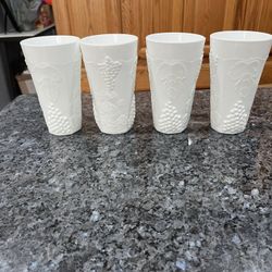  Vintage Milk Glass Harvest Grape Tumblers set of 4.  Size approximately 6 inches tall.  Preowned Excellent condition.  Has been in display in a cabin