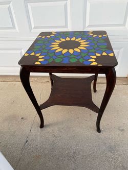 Vintage Wood Hand painted sunflower Unique side table  23.5 x 23.3 x 29 H.   Inches  Has a  crack on bottom shelf please check pictures .          Key