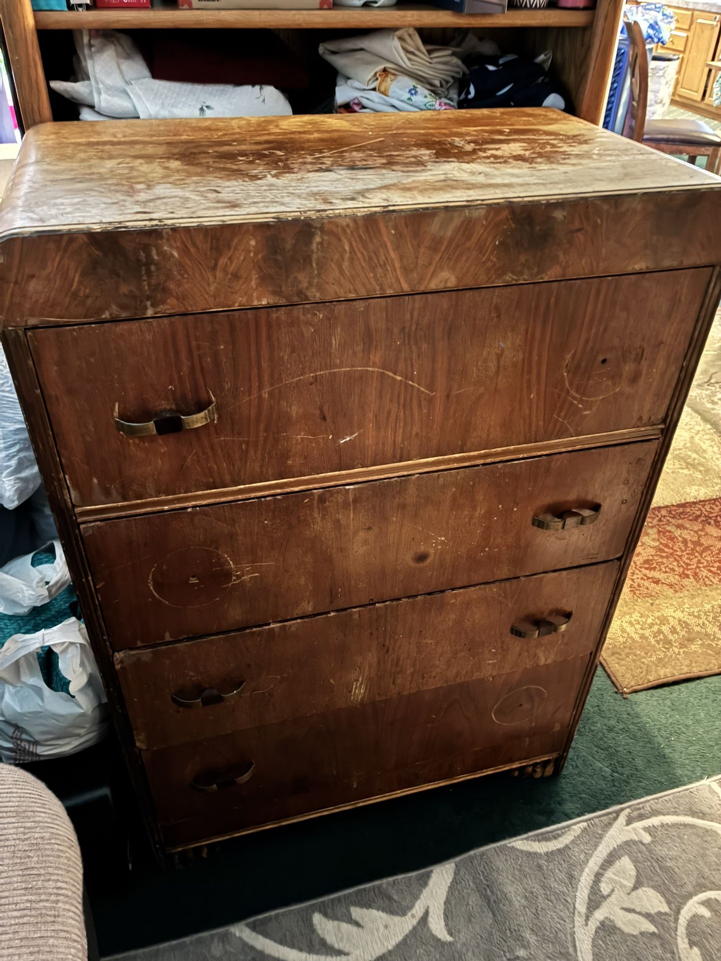 $75-Older wood dresser- not much to look at, but it is perfectly stable and nothing broken. Picked it up as a project to sand and repaint, and never g
