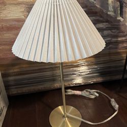 White pleated lamp with gold hardware