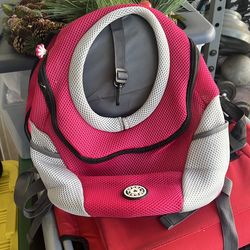 Fur Sport dog backpack carrier in pink and gray.