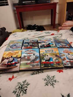 L Big lots of Thomas and Friends DVD and movie... TITLES INCLUDE:  School house delivery, the adventure begins, engines to the rescue, Dino's discover