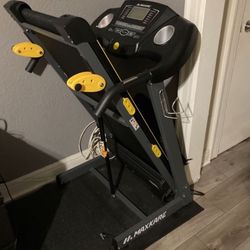 Treadmill Has 3 manual incline settings, preset program sets, heart rate monitor and safety folding feature . Barely used with original lubricant  . E